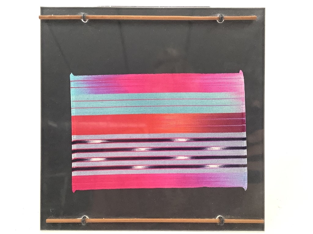 Mary Restieaux c. 1984 Silk Ikat Weaving Framed: Restieaux, Mary (England b. 1945). Silk Ikat Weaving, circa 1984. Identified in William Itter's hand verso. 4" x 6" (Sight). 8" x 87" (Frame). In a Plexiglas stand frame. Vibrant colors. Not examined 