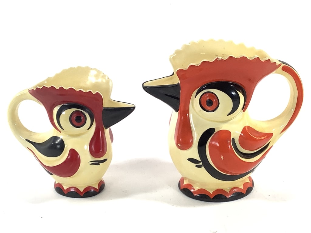 2 Erphila Rooster Pitchers: 6"H and 7"H pitchers. Stamp marked on bottom. Small areas of glass nicks/color loss. Provenance: Collection of William and Diane Itter.