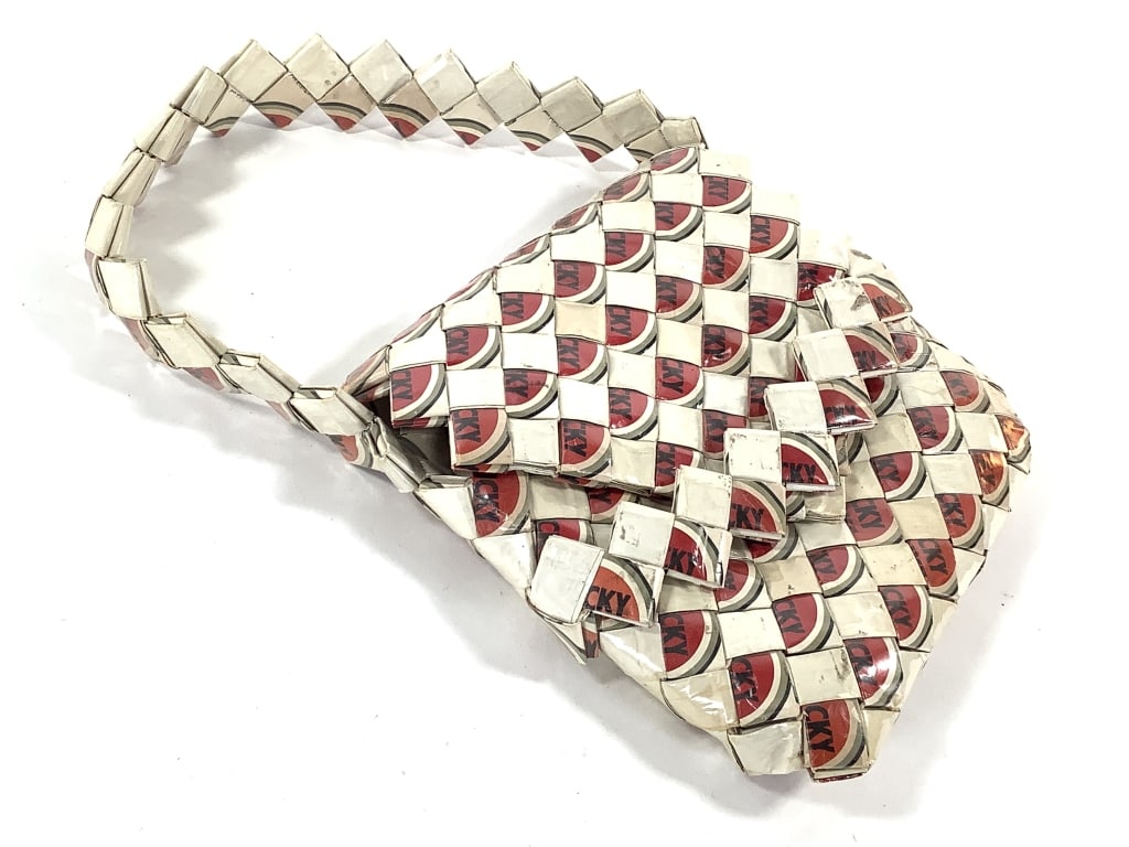 Lucky Strike Cigarette Folded Folk Art Purse: 8" x 8 1/4". Folk / Prison Art woven purse. Provenance: Collection of William and Diane Itter.