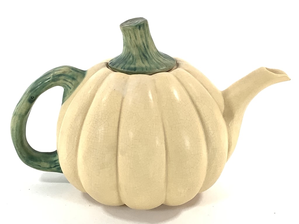 Weller Pottery Ceramic Squash Teapot: 6 1/4" tall with lid. Scratch marked / signed on bottom. Crazing. Pale cream with green 'stem' lid and handle. Provenance: Collection of William and Diane Itter.