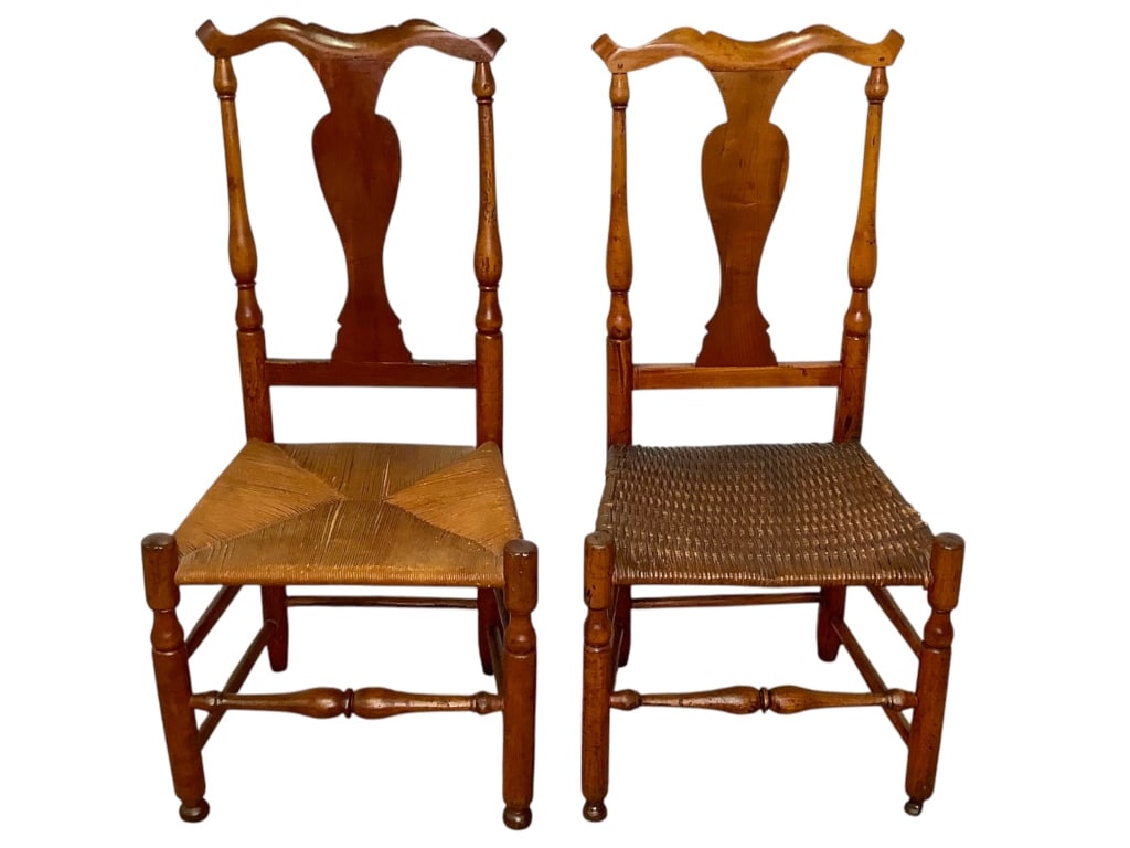 Pr 18th C New England Vernacular Side Chairs: 37 1/2"H. 1 with rush seat, 1 with split reed seat. American hardwood, likely fruitwood, mortised and pegged construction, vase-shape back. Similar but not exact matches, one may have been made as a c