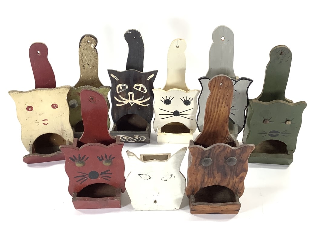 9 Folk Art Cat Matchbox Holders: 5" to 10"H. 1 of many lots. The walls of the Itter kitchen were covered with hand crafted and painted wood matchbox holders collected over a lifetime. NOTE: due to location these are all as found, nic