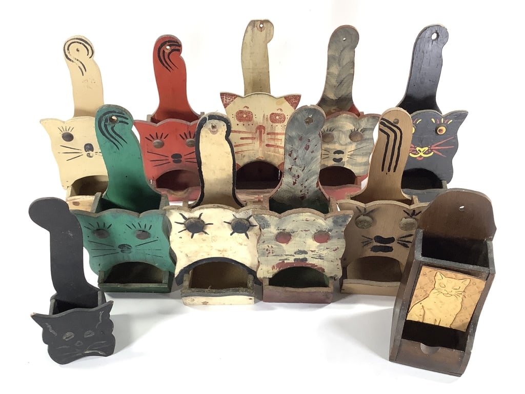 11 Folk Art Cat Matchbox Holders: 6 1/2" to 10 1/4"H. 1 of many lots. The walls of the Itter kitchen were covered with hand crafted and painted wood matchbox holders collected over a lifetime. NOTE: due to location these are all as fo