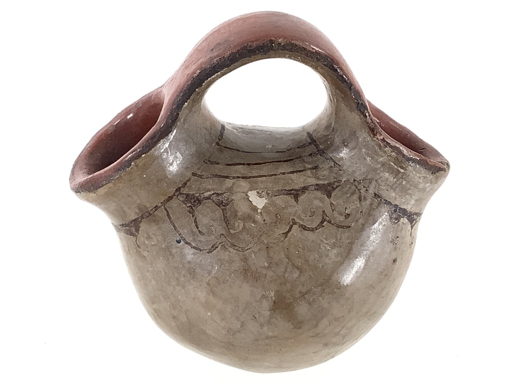 Pueblo Wedding Vase w/ Handpainted Designs: 3 1/2"W x 3"H. Painted details are worn but visible, one spout has minor chip along the rim. Expected wear and surface deterioration for age. Provenance: Collection of William and Diane Itter.