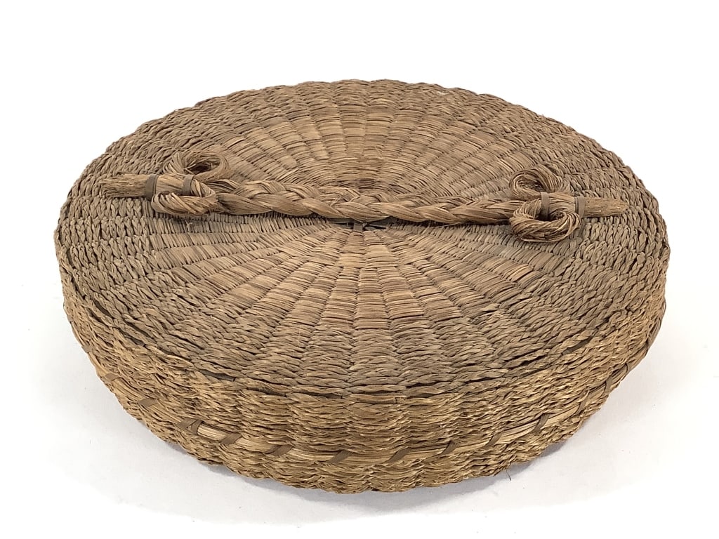 Lidded Sweetgrass Sewing Basket w/ Braided Handle: 10"W x 2"D. Overall clean tight coiling. Minor breakage / fraying to lid edges, as well as basket rim. Braided handle shows minor fraying but is largely intact. Provenance: Collection of William and D