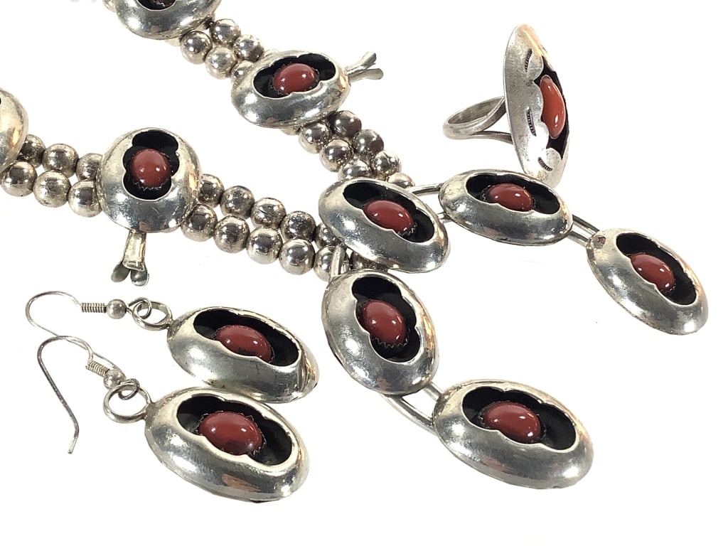 Shadowbox Coral Sterling Squash Blossom Set146g TW: Necklace, 27"L. Ring, sz 7.5. Matching earrings. Traditional crescent Naja pendant w/ coral cabochons. Unmarked; tested sterling. Stones are secure; good condition.