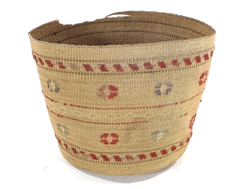 Finely Twined Spruce Root Basket w/ Floral Motifs: 7 1/2"W x 6"H. Large section along rim is damaged. Floral motifs appear to be made from yarn woven into the basket, some areas show yarn loss. Fragile. Provenance: Collection of William and Diane Itte