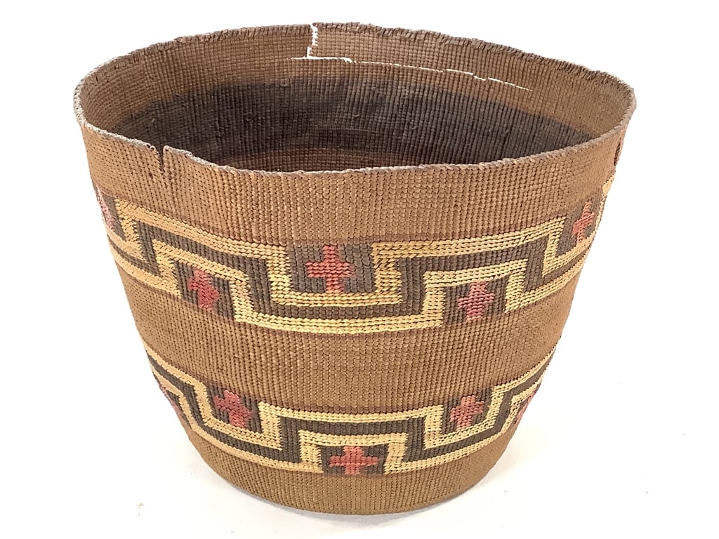 Finely Twined Geometric Polychrome Basket: 8 1/2"W x 6"H. Large section of rim is damaged, as well as several cracks and splints within the body. Tight coiling in areas that are not broken, little to no fraying. Provenance: Collection of Willi