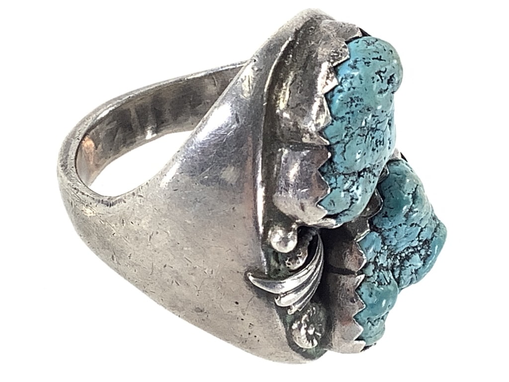 Silver & Turquoise Nugget Ring 28.7g TW: 1 1/4" L face. Sz 11. Unmarked; tested sterling. Stones are secure; patina present.