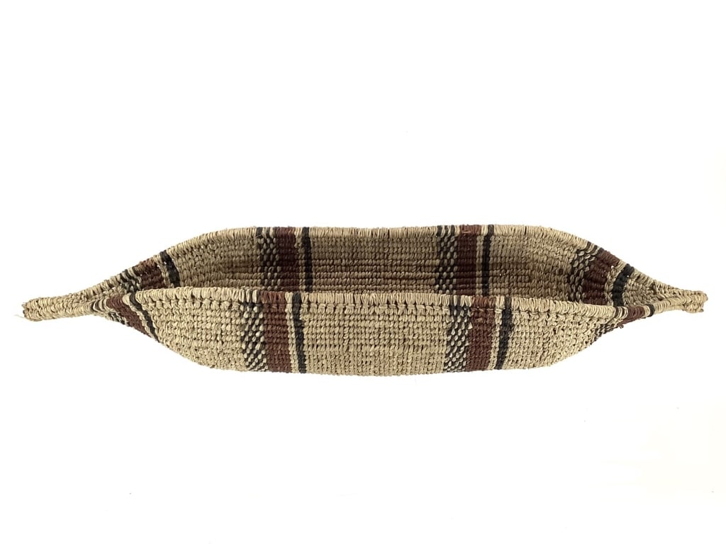 Polychrome Banded Canoe-Form Coiled Basket: 22"L x 4"W x 3 1/2"H. Minor fraying and expected wear throughout, consistent with age. Overall structurally intact. Provenance: Collection of William and Diane Itter.
