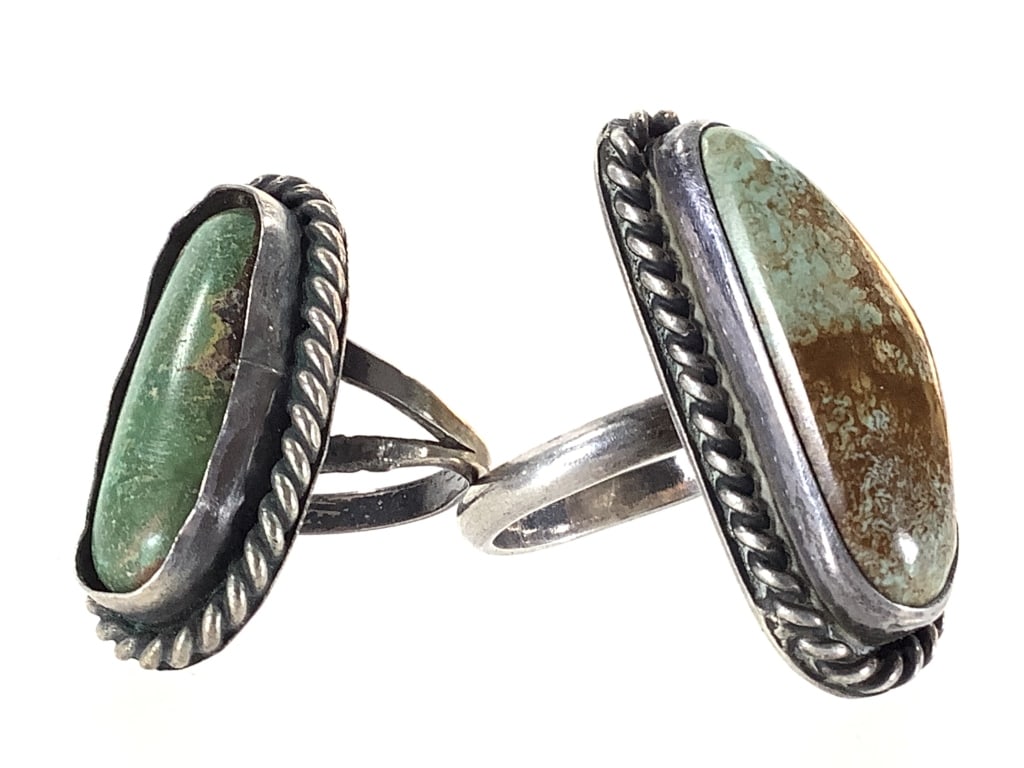 2 Sterling Rings Green Turquoise 18.2g TW: Larger ring is sz. 8 1/2". Smaller is sz. 5. Stone in smaller ring is loose. Age related patina. Marked sterling.