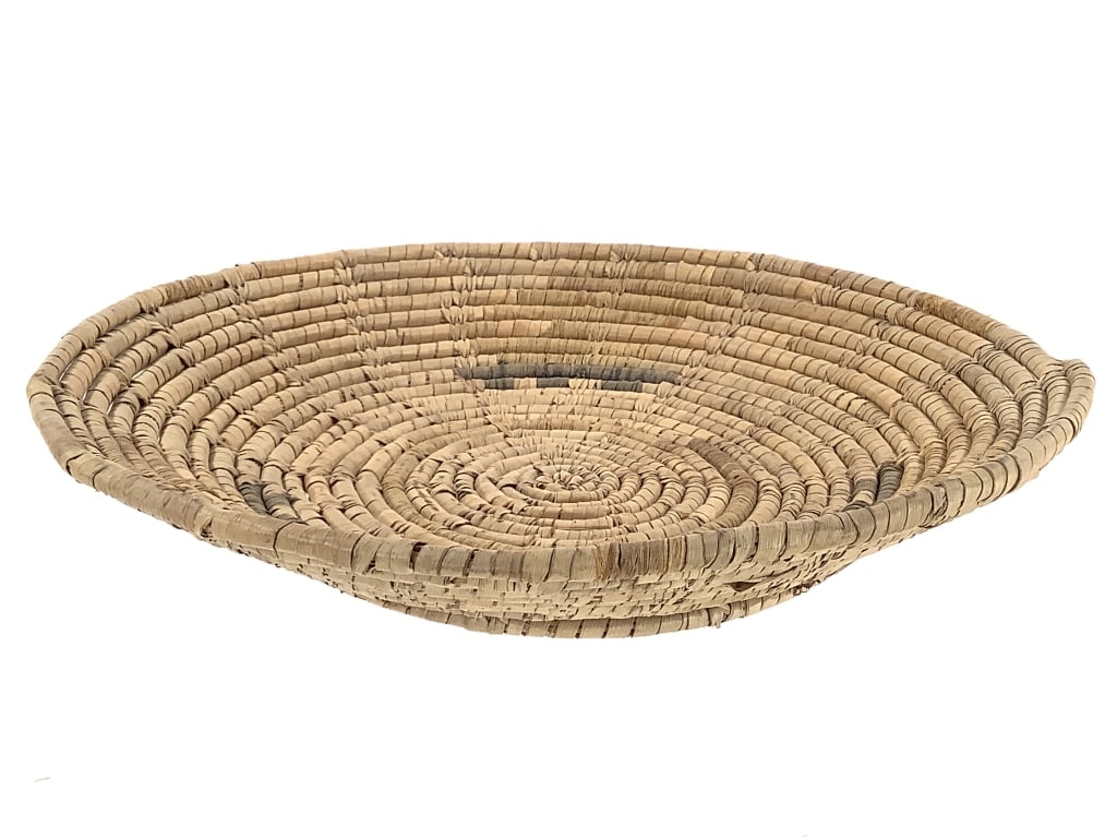 Polychrome Coiled Grass Basket Tray: 10"W x 2"H. Minor fraying throughout. Overall structurally intact. Polychrome coloration is more visible on underside. Provenance: Collection of William and Diane Itter.