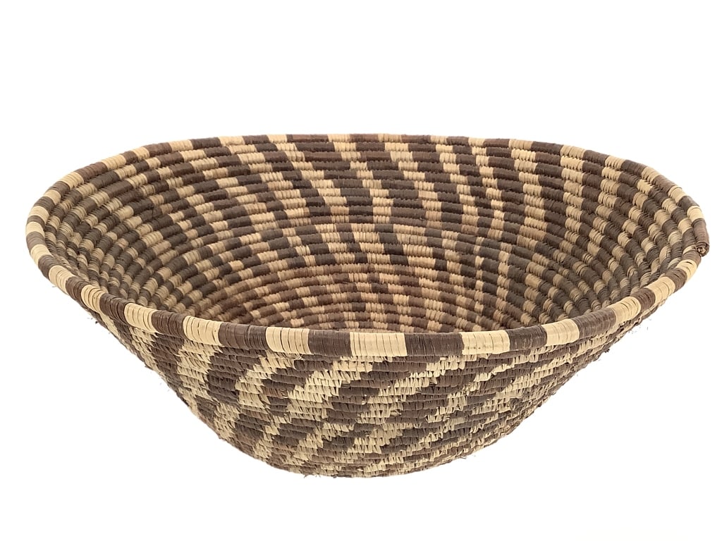 Lg Coiled Basketry Bowl w/ Spiral Design: 11 1/2"W x 4"D. Minor fraying throughout consistent with age. Overall structurally intact, tight coiling in most areas. Bi-color spiral design. Provenance: Collection of William and Diane Itter.