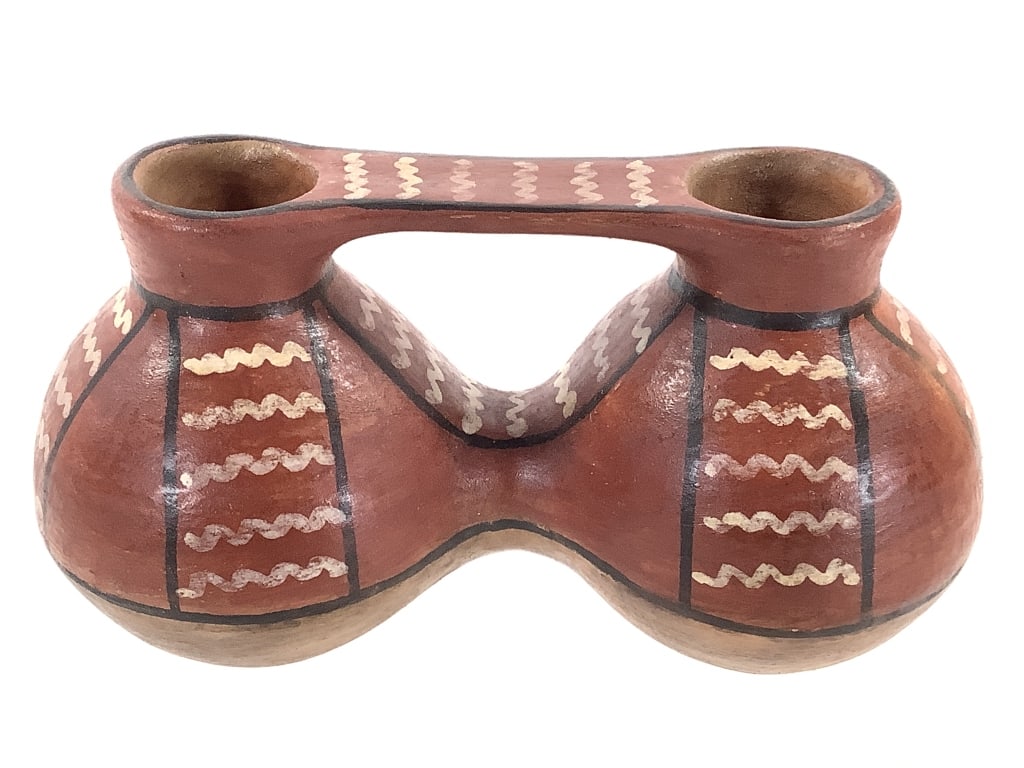 Signed Arica Chile Wedding Style Pottery Vase: 7 1/2"L x 3 1/2"W x 4"H. Decorated with hand painted geometric designs, signed on bottom. No chipping or damage, overall very good condition.