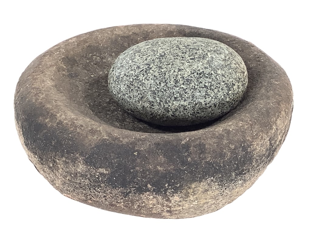 Early Mano Grinding Stone: 5 1/2"W x 2 3/4"H. Exact age and origins unknown. From the collection of IU Emeritus Professor John Johnson. Please Note: The artifacts in this auction have not been professionally authenticated.