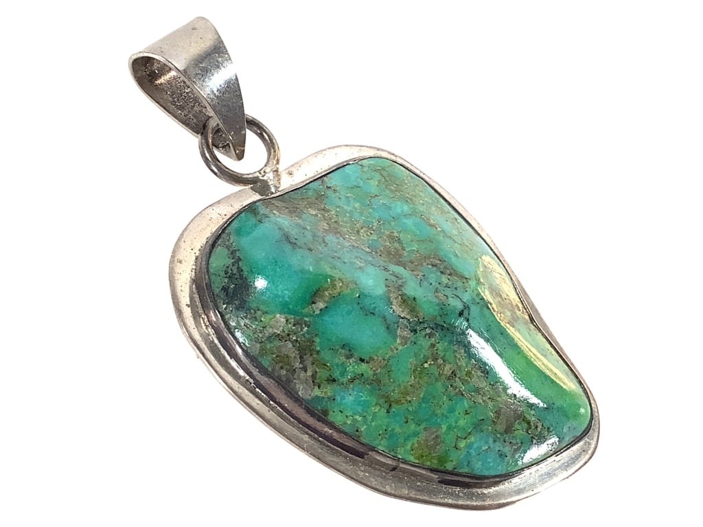 Sterling Turquoise Pendant 23.5g TW: 2 1/2" H. Sticker residue on back.
