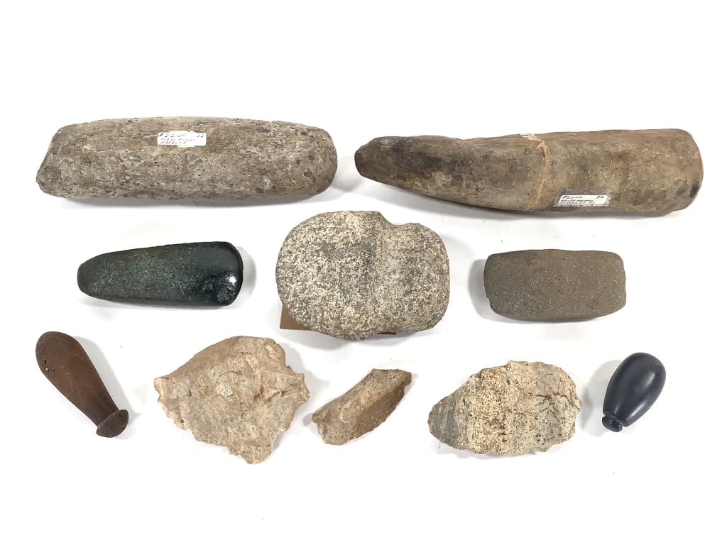 Primitive Axe Head, Adze, Pestle & More: 9 total artifacts. From the collection of IU Emeritus Professor John Johnson. Please Note: The artifacts in this auction have not been professionally authenticated. Items may include reproductions,