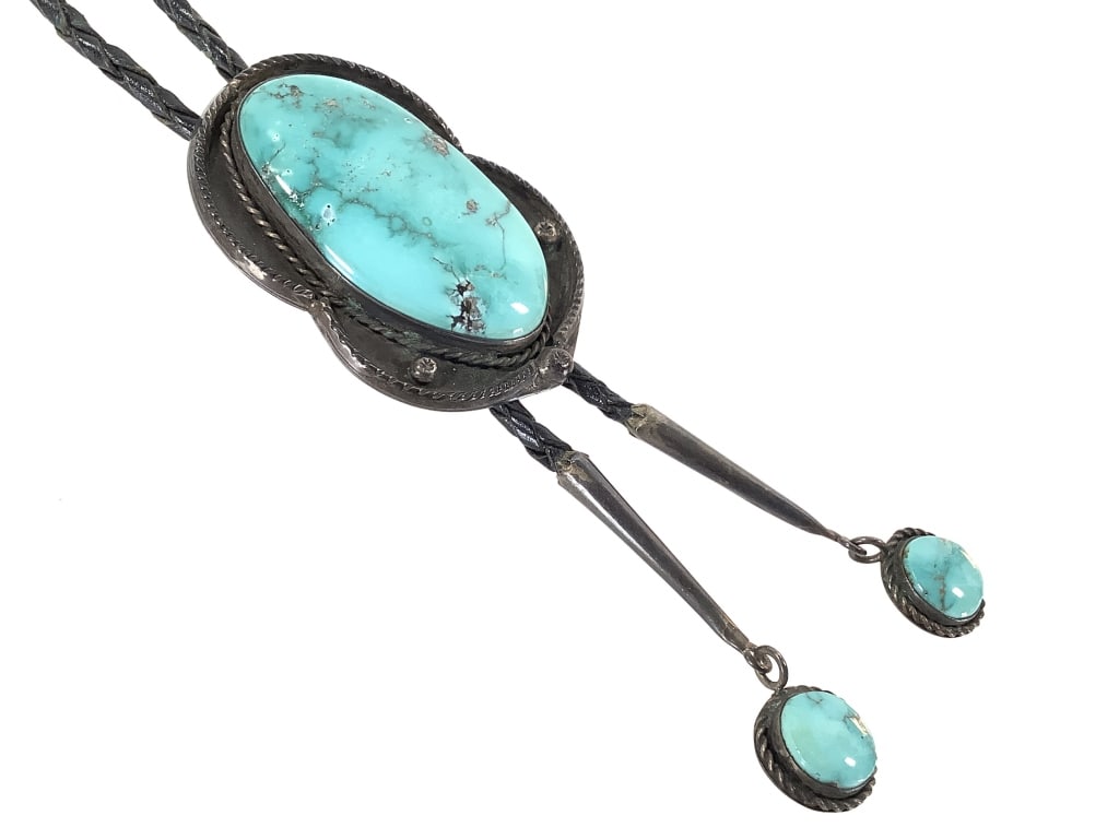 Artist Marked Turquoise Bolo 77g TW: No sterling mark noted. 3" H with leather cord and fittings.