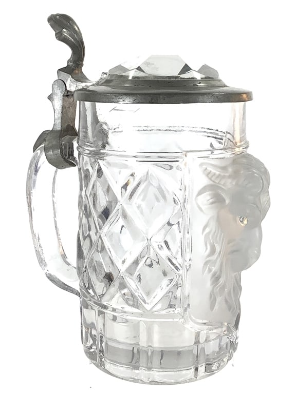 German Glass Beer Stein w Goat Face: 7 1/4"H overall, 3 1/2"Dia. Heavy glass beer stein with frosted raised goat head. Pewter lid with thumb hinge. Germany c.1940-50s. Unmarked. Good condition overall.