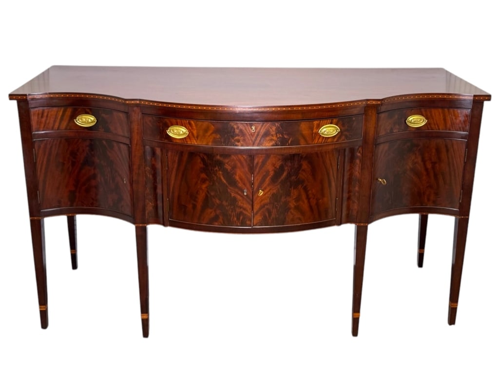 Nathan Margolis Federal Sideboard Hart Provenance: 72"W x 28 1/4"D x 41 1/4"H. Fine mahogany sideboard, matched crotch mahogany door faces. Satinwood and ebony inlay banding (matching dining table lot 294f). Paper label: "This sideboard was made for M