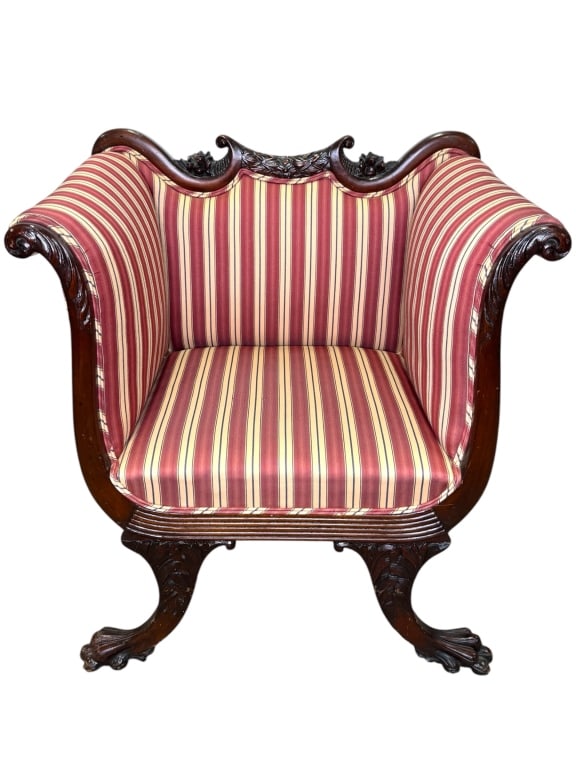 American Empire Revival Arm Chair: 30"W x 21"D x 33 1/2"H. Striped upholstery, carved griffin feet, highly ornate carved solid wood frame. Late 1800-Early 1900s. Surface scuff on legs.