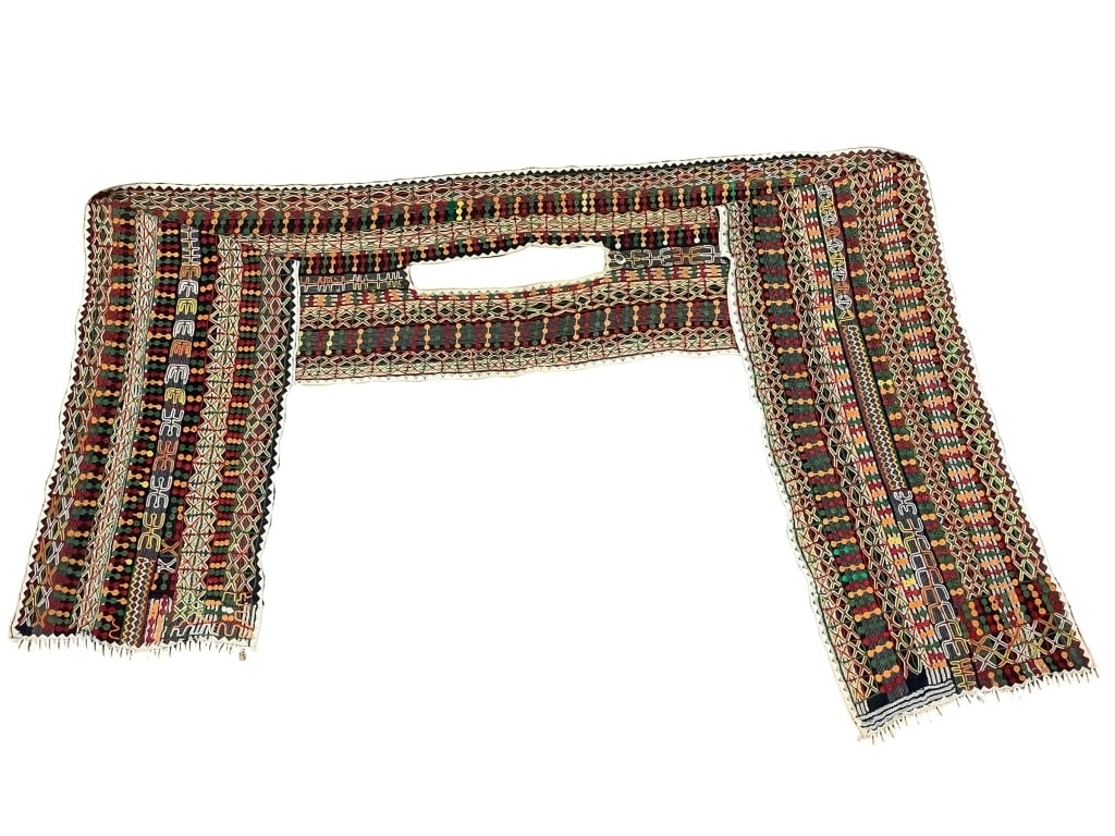 Young Mens Tunic Fula People Nigeria: 52"L x 13 3/8"W at shoulder. Embroidered tunic with fabric applique triangular border and cowrie shells at bottom edge. Lower left cowrie shell has loose thread Provenance: Collection of William and