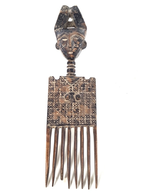 Akan Afe Ceremonial Comb Carved Wood Ghana: 12 1/4" x 3 3/8". One tooth of comb has loss at the end. Provenance: Collection of William and Diane Itter. Please see photos for condition and details.