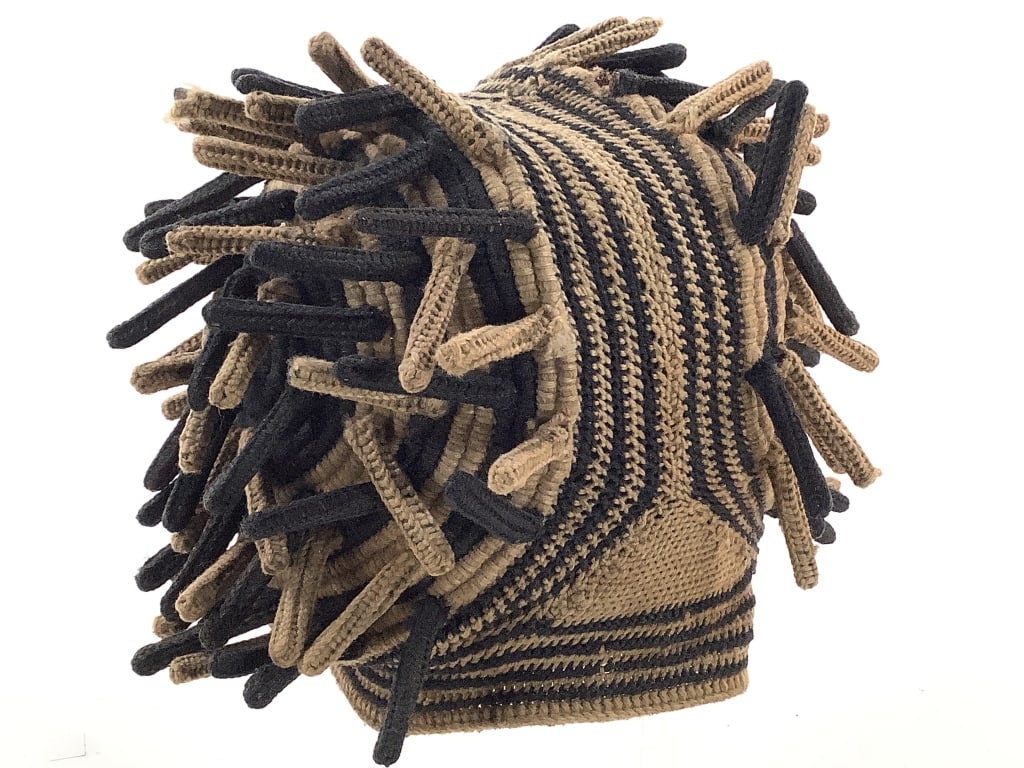 Bamileke or Bamenda Ashetu Prestige Hat Cameroon: Approximately 8 3/4"W x 7"H with spikes. Knitted hat with two side sections of 1 3/4' spikes and stripes running through the center of the hat, Made of wool, spikes have a hard material insert inside