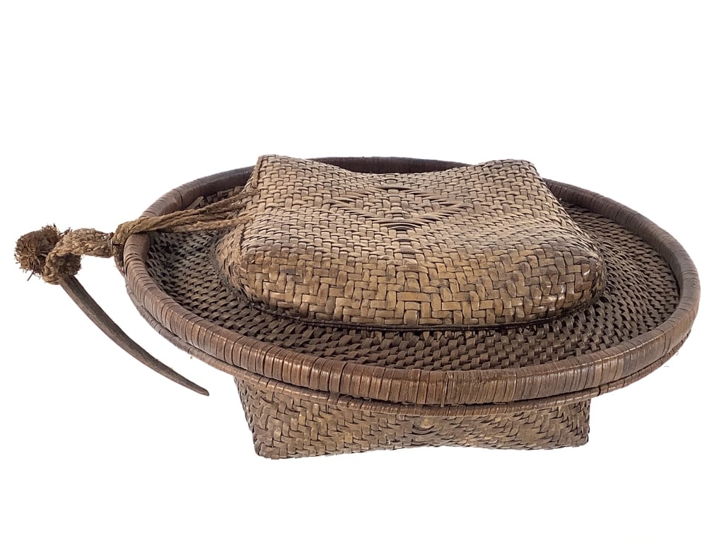 Kuba Lidded Basket Congo: 10"Dia, 3 5/8"H. Four point design lidded basket with braided rattan and wood closure. Provenance: Collection of William and Diane Itter. Please see photos for condition and details.