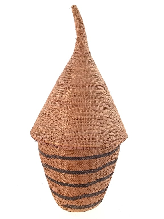 Tutsi Lidded Coiled Basket: 7"H x 3 1/2"Dia. Provenance: Collection of William and Diane Itter. Please see photos for condition and details.