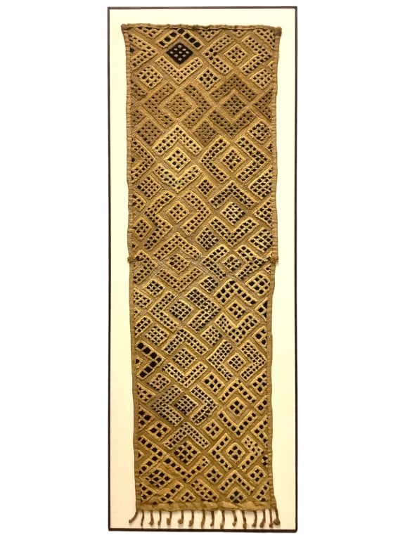 Kuba Cloth Framed: 50 1/8" x 19 5/8" Framed. Plain weave woven raffia with embroidered cut-pile geometric design of black and natural colors. Provenance: Collection of William and Diane Itter. Please see photos for