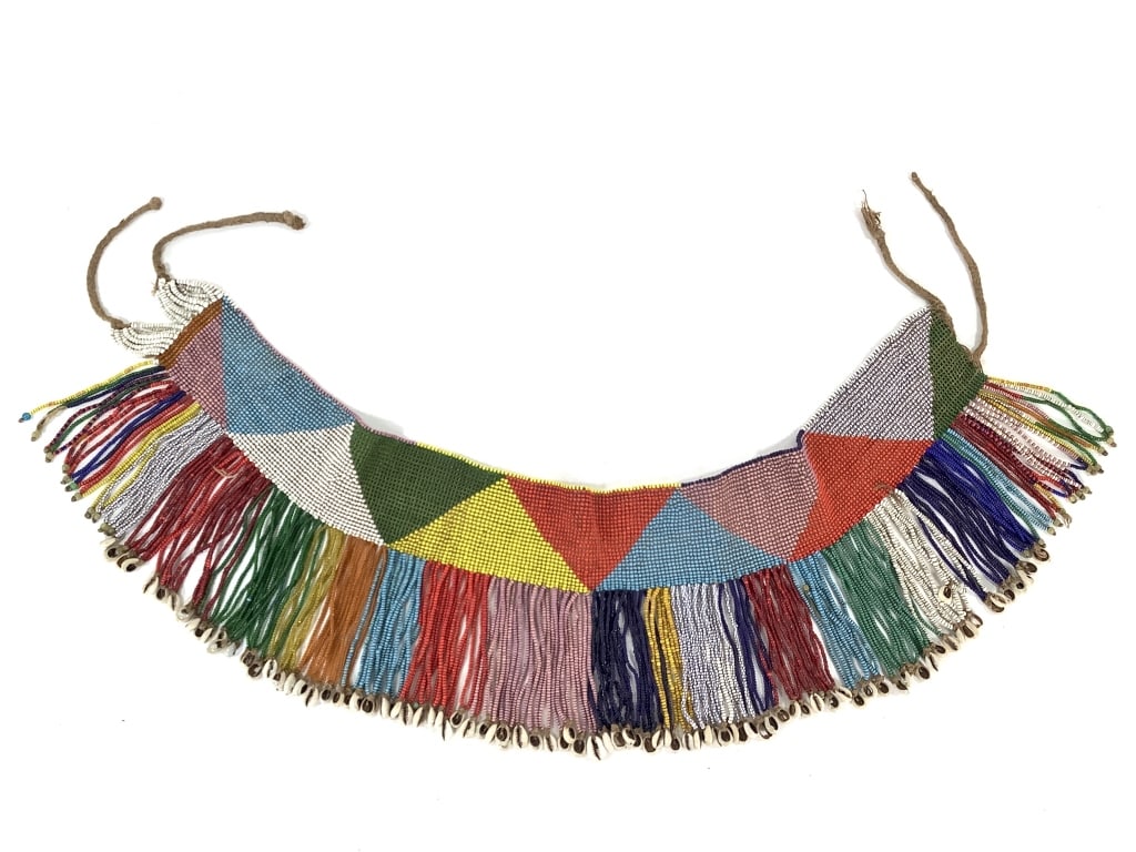 Ethiopian Gondar Area Beaded Apron: 30"W excluding ties, 7 3/4"H. Provenance: Collection of William and Diane Itter. Please see photos for condition and details.