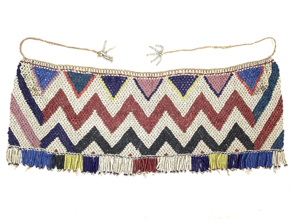 Kirdi Beaded Apron Cameroon: 27 1/2"W x 10 5/8"H including fringe. Provenance: Collection of William and Diane Itter. Please see photos for condition and details.
