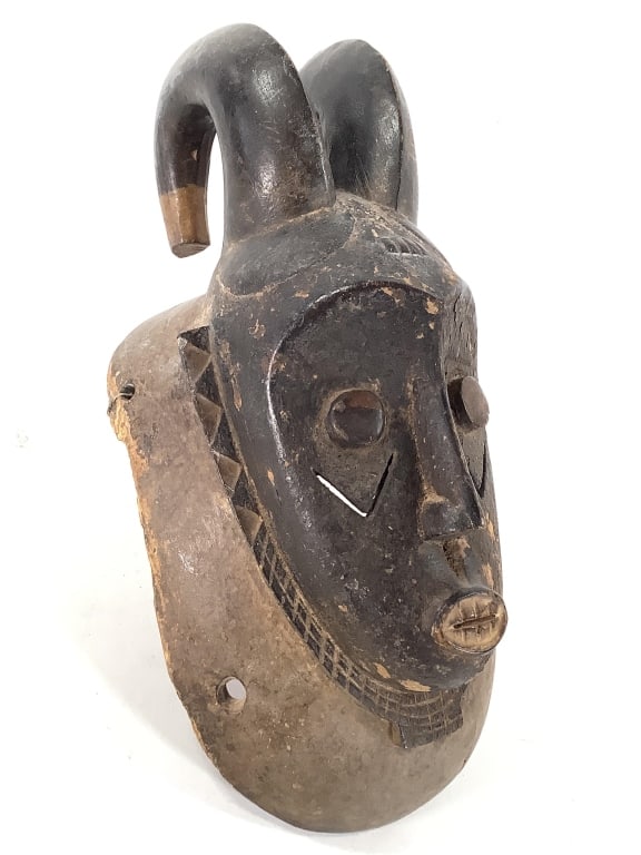 Baule Rabbit Mask Ivory Coast: 17"H x 8"W. Carved wood with traces of pigment. Fair condition, natural wear consistent with age, with some fading. Provenance: Collection of William and Diane Itter. Please see photos for condition a