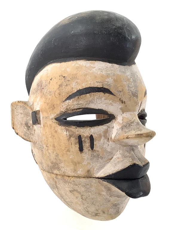 Ogoni Moving Jaw Mask Nigeria: 7"H x 6"W. Hand-carved wood with painted surface. Good condition, natural wear consistent with age. Provenance: Collection of William and Diane Itter. Please see photos for condition and details.