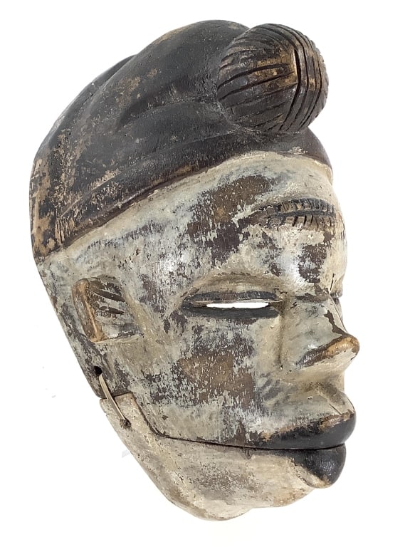Ogoni Moving-Jaw Mask Nigeria: 8 1/2"H x 5 1/2"W. Hand-carved wood with fiber cord hinge. Good condition, natural wear consistent with age. Provenance: Collection of William and Diane Itter. Please see photos for condition and deta