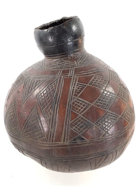 Large African Gourd: 13 1/8"Dia. x 15 1/2"H. Provenance: Collection of William and Diane Itter. Please see photos for condition and details.
