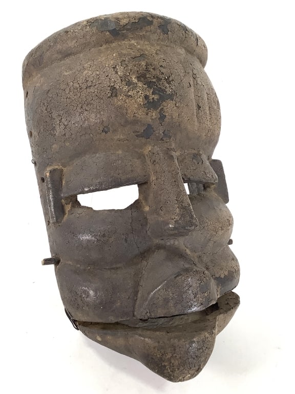 Ogoni Ibibio Elu Moving Jaw Mask: 12"H x 9"W. Presence of holes, Fair condition for age. Provenance: Collection of William and Diane Itter. Please see photos for condition and details.