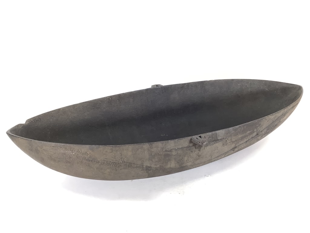 Ceremonial Bowl Papua New Guinea: 30 1/2"W x 13"D x 5 3/4"H. Traditionally carved From hardwood and blackened with volcanic mud. Provenance: Collection of William and Diane Itter. Please see photos for condition and details.