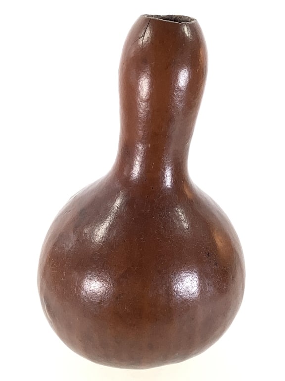 African Bottle Gourd: 5"Dia x 9"H. Provenance: Collection of William and Diane Itter. Please see photos for condition and details.