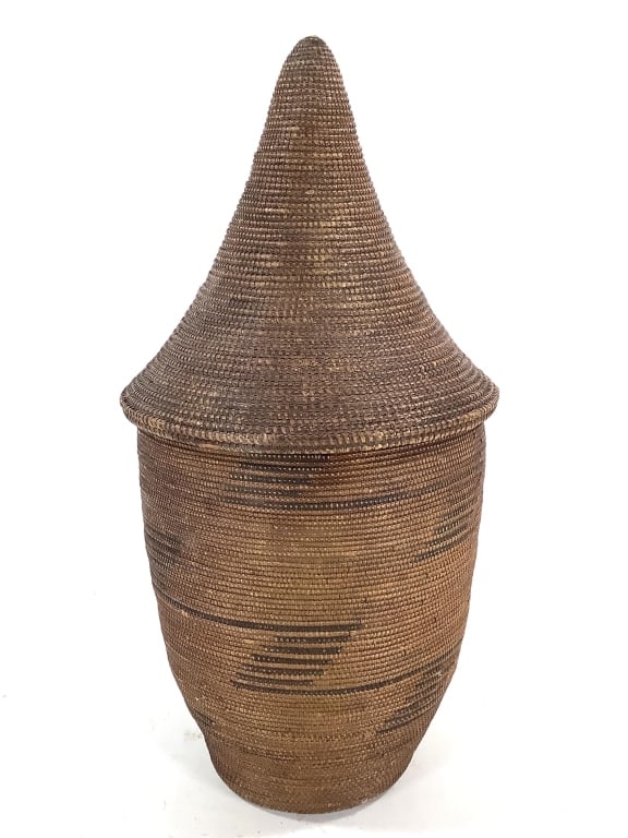 Tutsi Rwandan Coiled Weave Basket: 16 1/8"H x 8 1/2"Dia. Provenance: Collection of William and Diane Itter. Please see photos for condition and details.