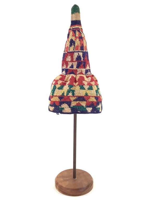 Cameroon Grasslands Prestige Hat: 12 1/4"H. Crochet hat with a geometric design in bright colors. Comes with display stand. Provenance: Collection of William and Diane Itter. Please see photos for condition and details.