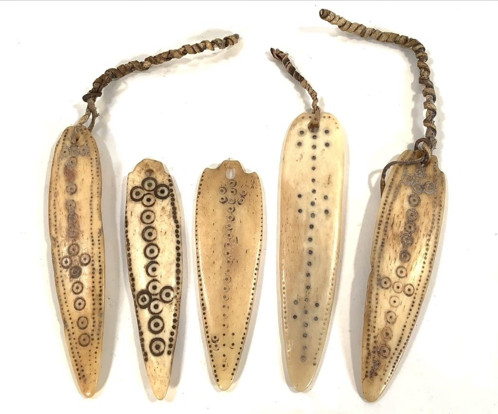 5 Ethiopian Medicine Pendants Amulets: Longest, 4 3/4"L. Carved and incised bone amulets. Provenance: Collection of William and Diane Itter. Please see photos for condition and details.