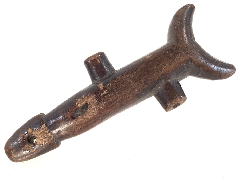 Carved Wood Lobi: 5"L x 1 3/4"W. Surface wear rubbing on the wood. Provenance: Collection of William and Diane Itter. Please see photos for condition and details.