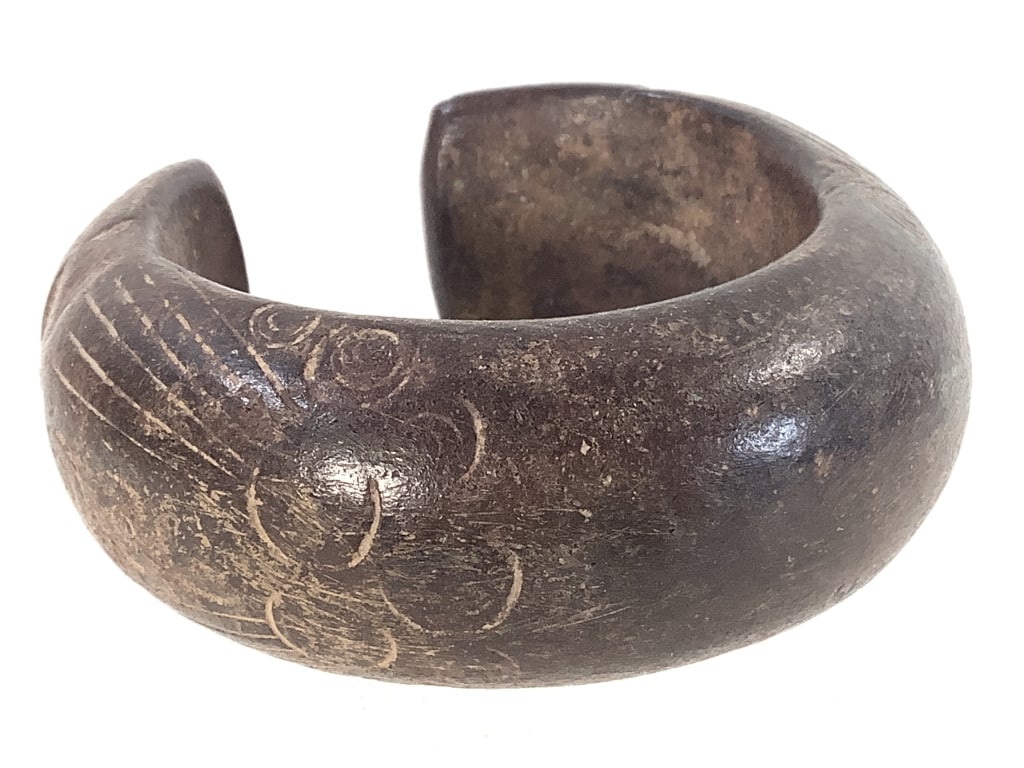 West African Currency Bracelet: 3" x 3 1'8". Provenance: Collection of William and Diane Itter. Please see photos for condition and details.
