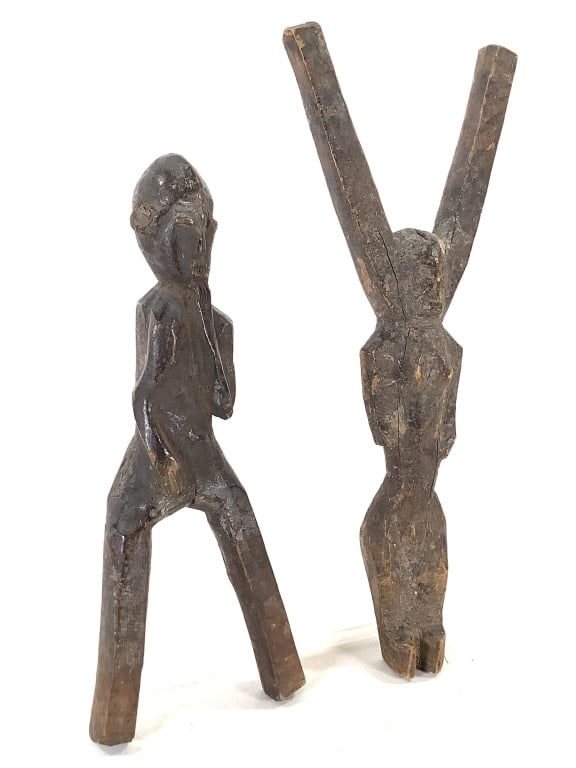 Pair Figural Potomo Waka Baule Slingshots: 10 3/4"H x 4 1/4"W. Carved wood, Ivory Coast. Overall fair condition, natural wear consistent with age, some cracks appearing. Provenance: Collection of William and Diane Itter. Please see photos for