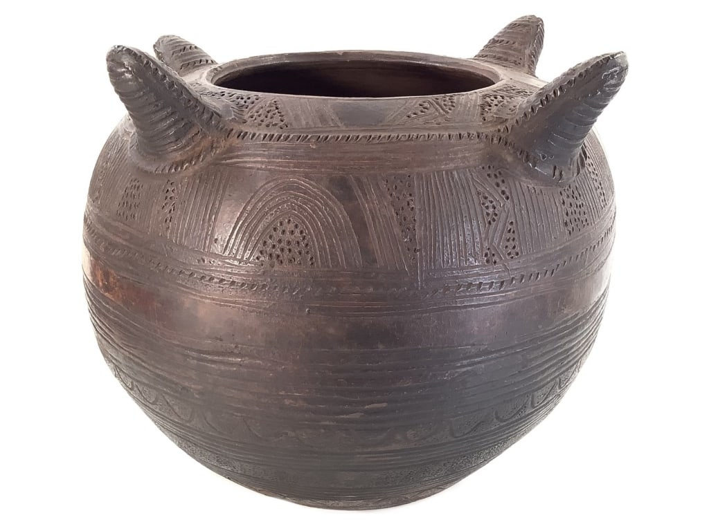 Nupe Water Vessel Nigeria: 3"H x 13" Dia. Hand-formed terracotta with a warm, weathered surface. Good condition, natural wear consistent with age. Provenance: Collection of William and Diane Itter. Please see photos for