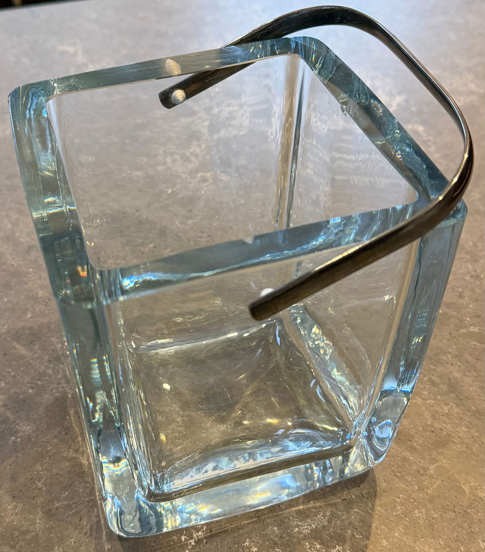 Cartier Glass Ice Bucket Strombergshyttan Collaboration "Extremely Rare": This is a large Cartier glass ice bucket large enough to fit a champagne bottle in it and it was made with the company Strombergshyttan which burnt down in the summer of 1973. It also has a sterling s