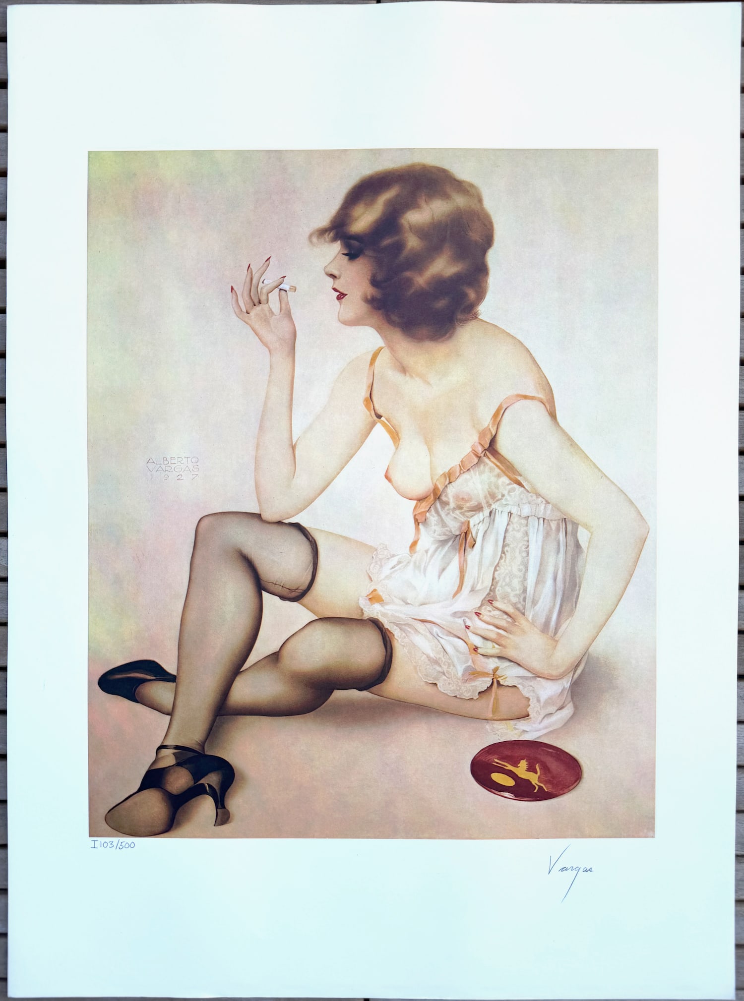 Alberto Vargas "Smoke Dreams" Lithograph 1978 103/500: Alberto Vargas's lithograph "Smoke Dreams" (often titled "Smoke in Dreams" in some references) captures an intimate, introspective moment from his early Ziegfeld Follies-inspired work, originally crea