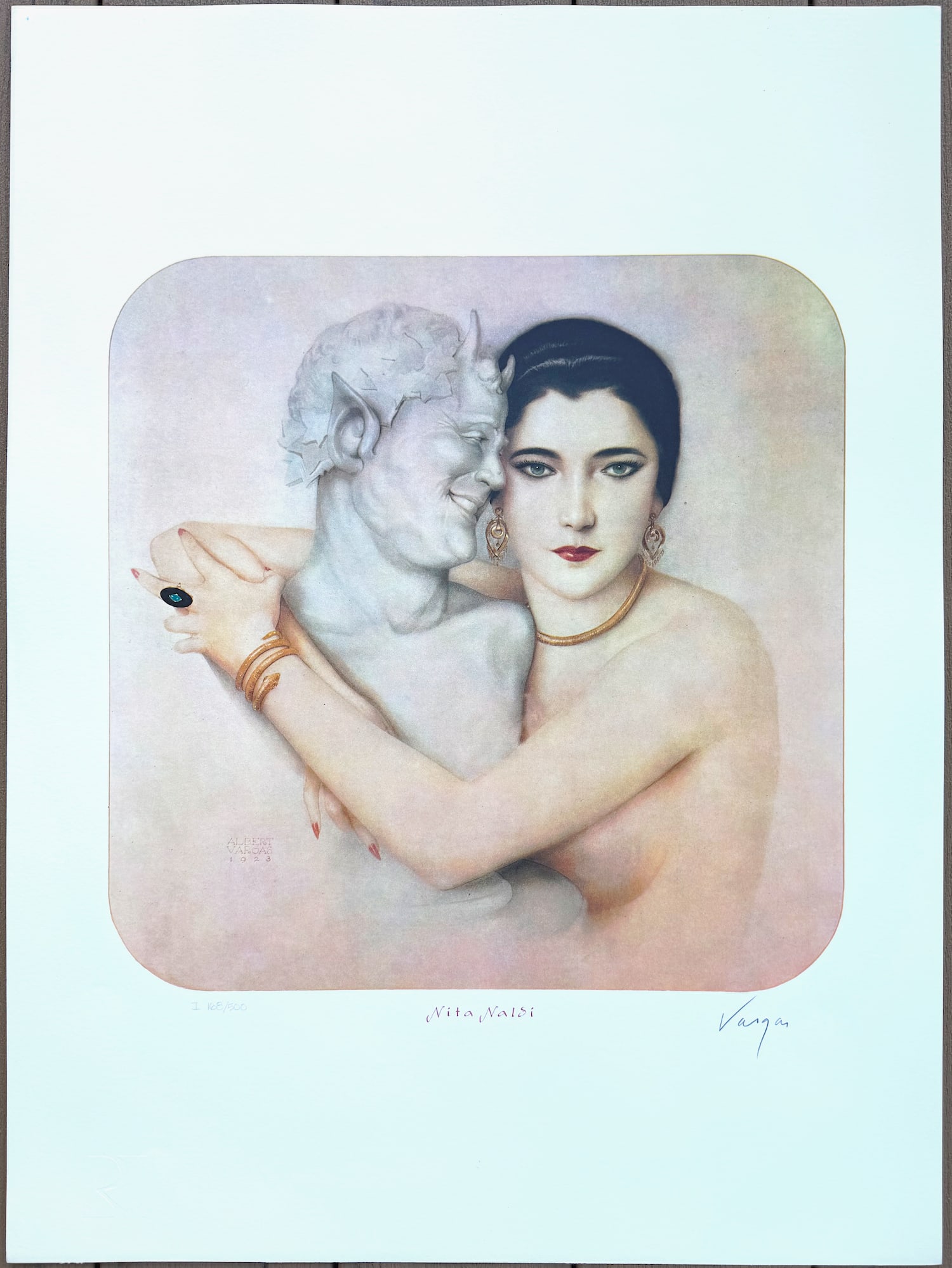 Alberto Vargas "Nita Naldi" 168/500 Lithograph 1980: Nita Naldi, Ziegfeld Follies performer and star of the silent screen, once set the heart of Rudolph Valentino on fire. In this portrait, the actress also seems to bring life to a stone statue of Pan. 